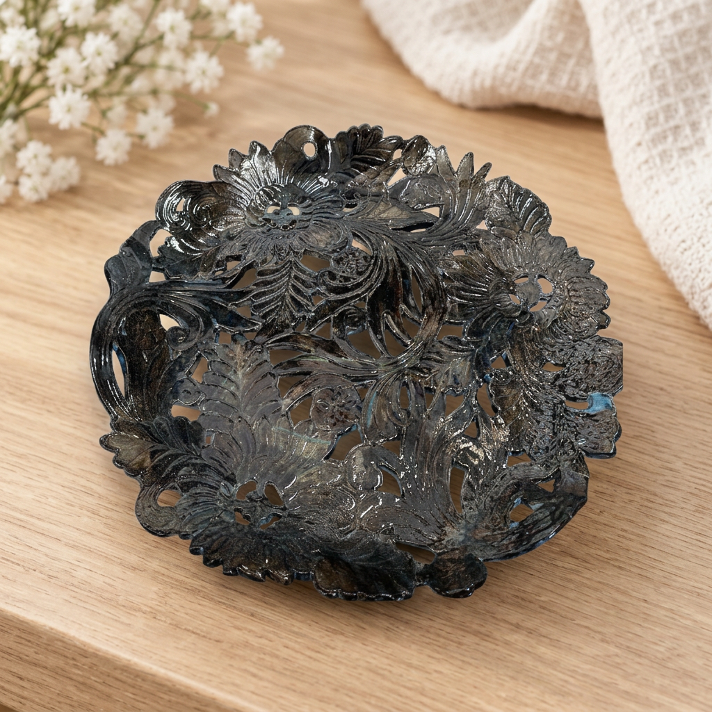 Dark floral ceramic platter on a warm wooden tabletop with white flowers and cream fabric