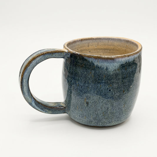 Blue ceramic mug on a soft-white background