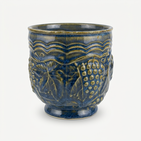 Blue ceramic planter on soft white