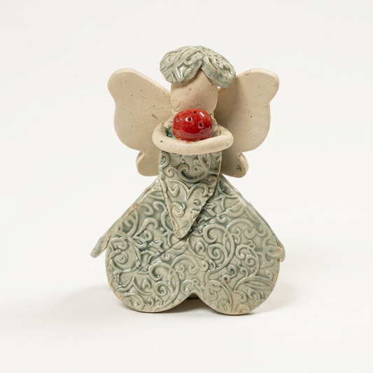 Ceramic fairy on a soft-white background