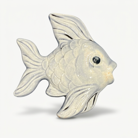Ceramic fish on soft white