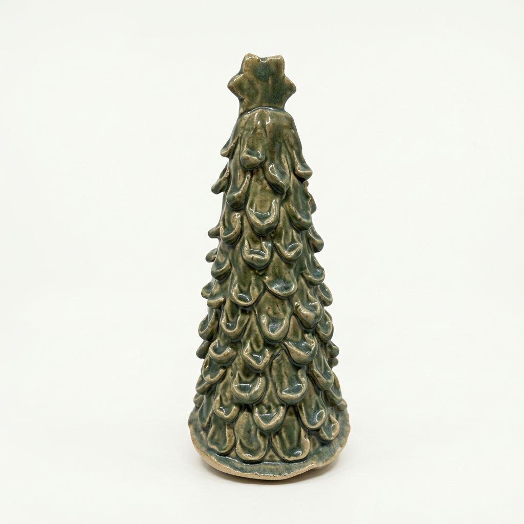 Green glazed ceramic tree on soft white