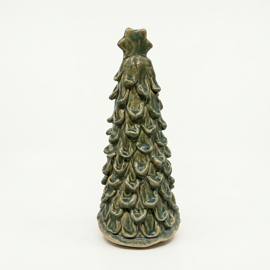 Green glazed ceramic tree on soft white