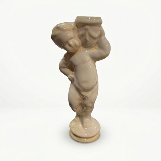 Sculpted figurine on a soft-white background